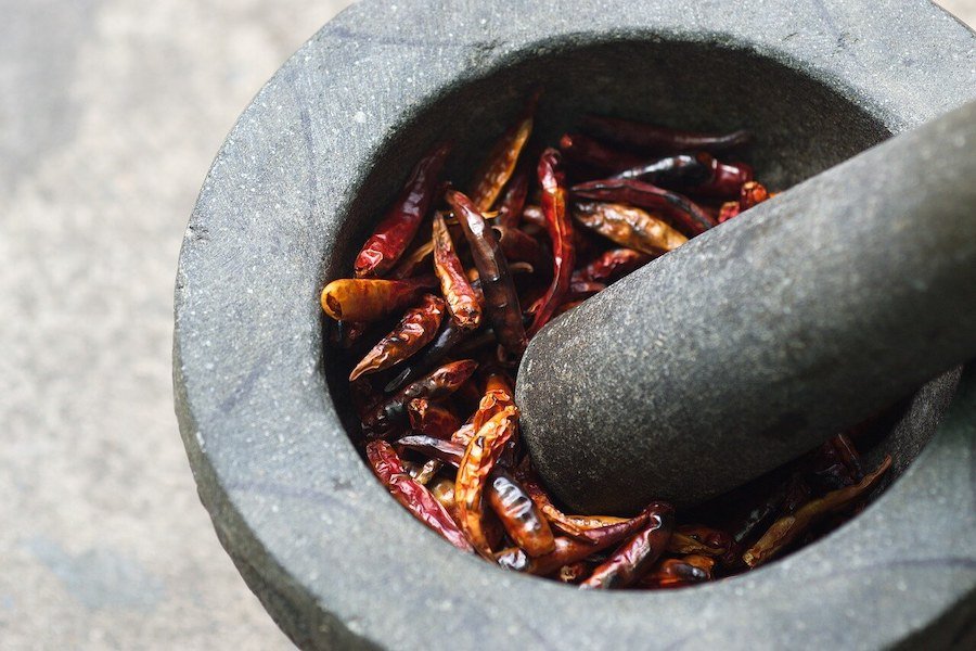 drying cayenne pepper and grinding it into powder