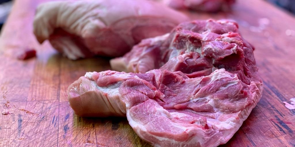 raw meat on brown wooden table